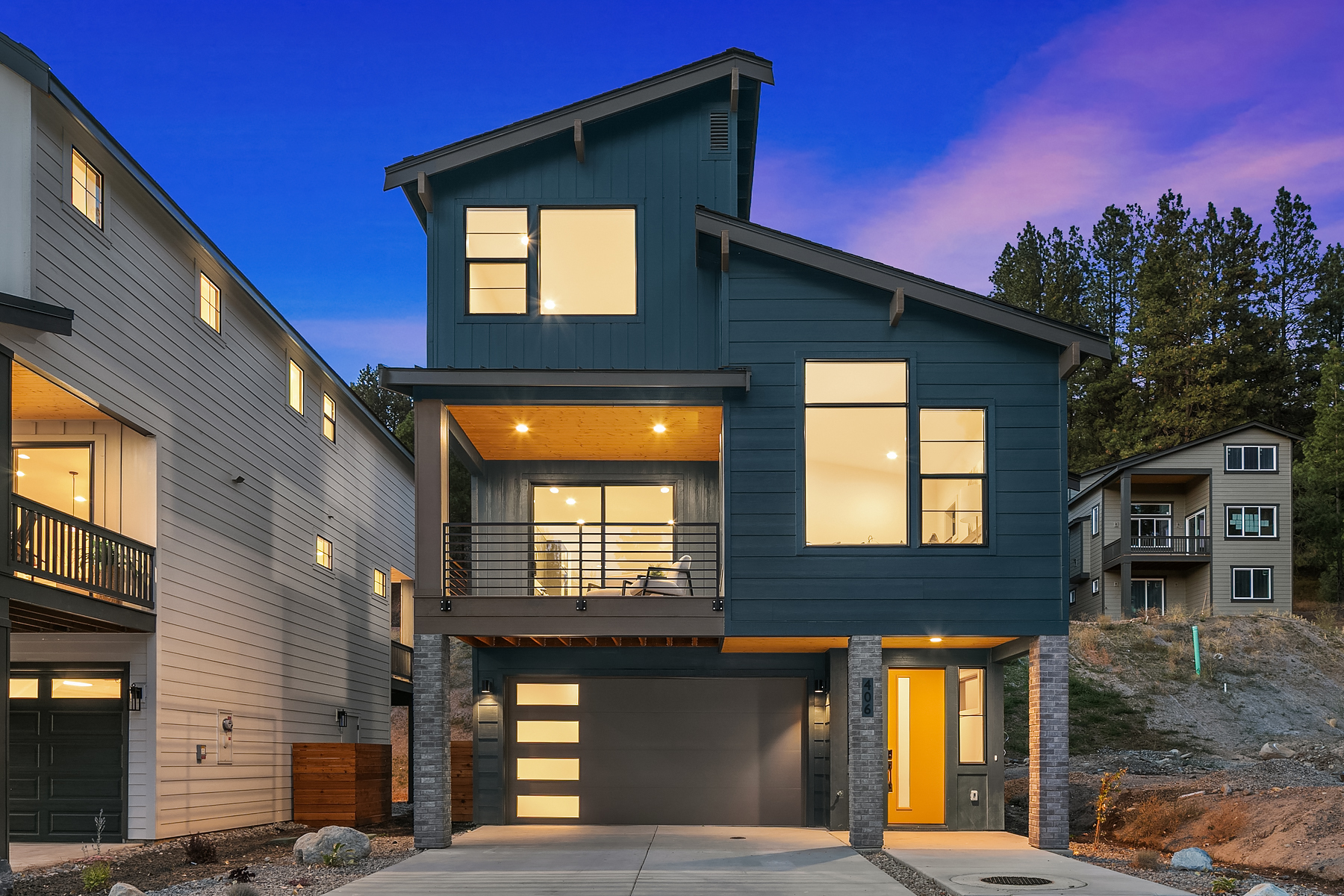 three story home in Cle Elum with blue paint taken at twighlight so the windows are illuminated