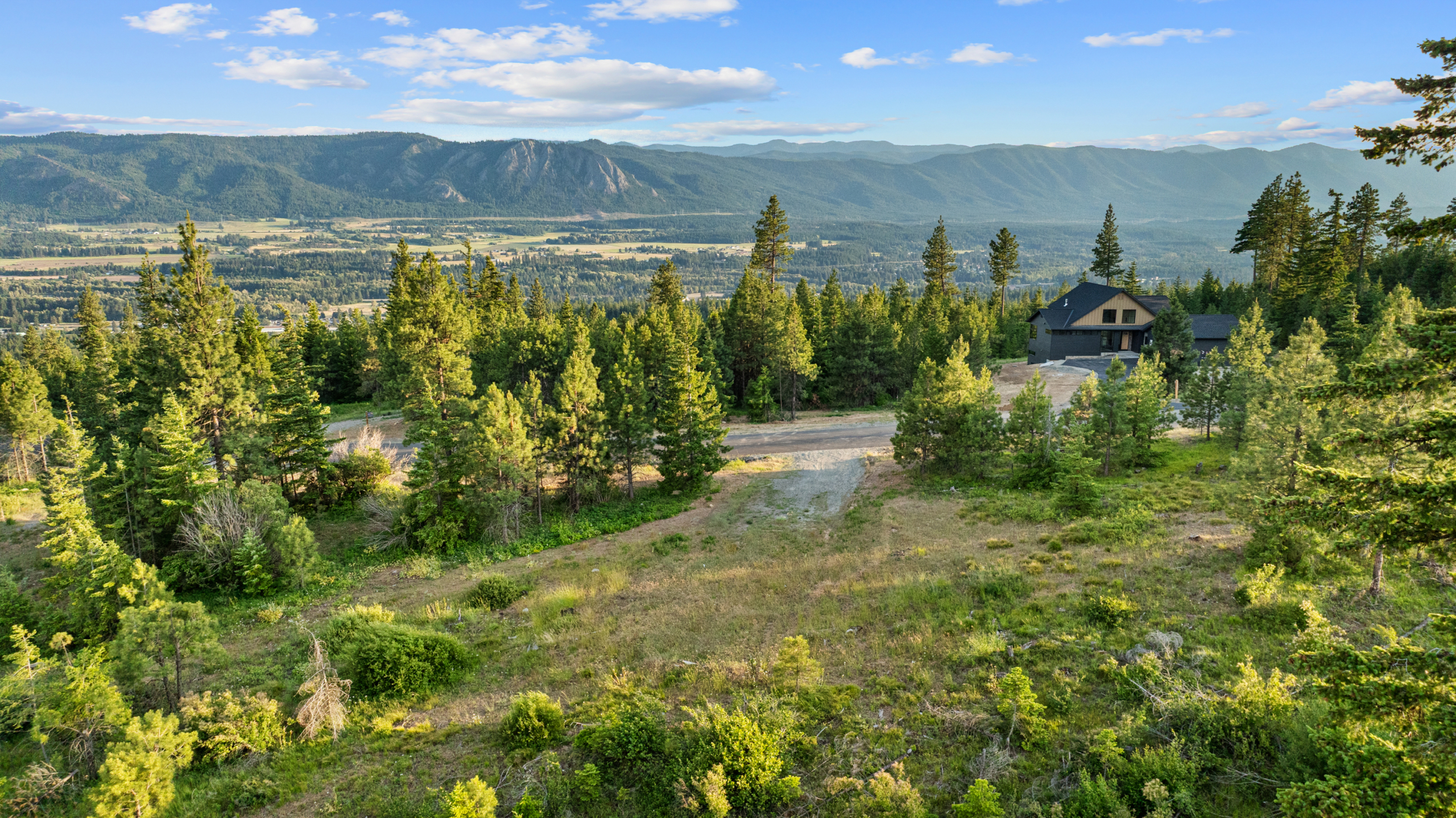 Homesite 11 ariel view of the mountains and trees surrounding the lot