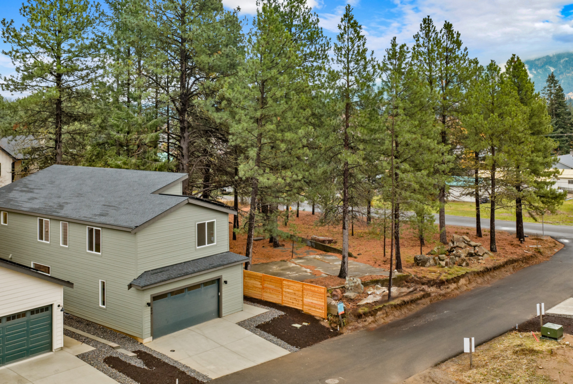 Ederra 19 exterior with ally load garage and tree lined property