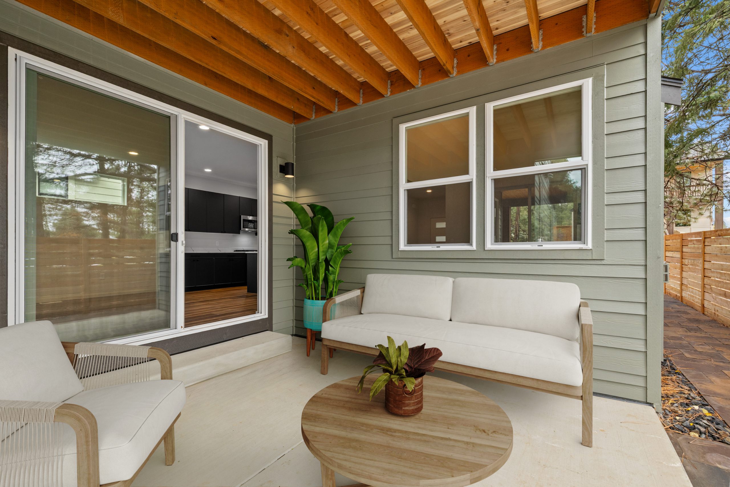 Tronsen by Trailside Homes in Ederra outdoor covered patio off the dining room surrounded by forest in Cle Elum