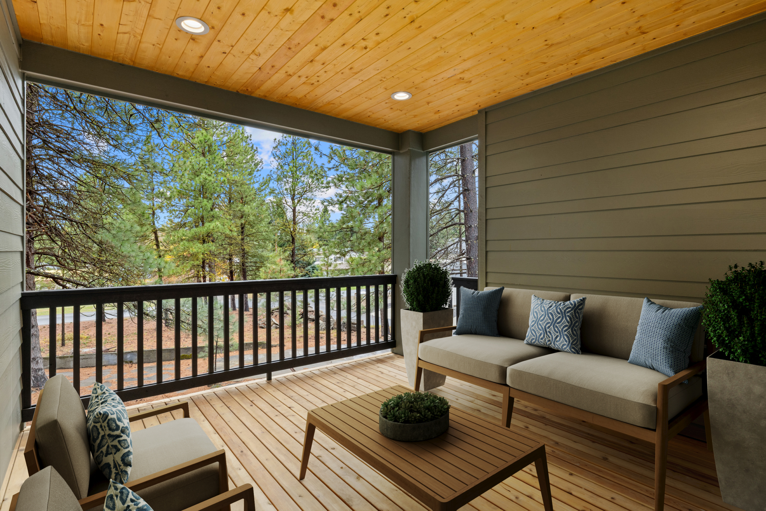 Tronsen by Trailside Homes in Ederra outdoor covered deck with view of the forest in Cle Elum