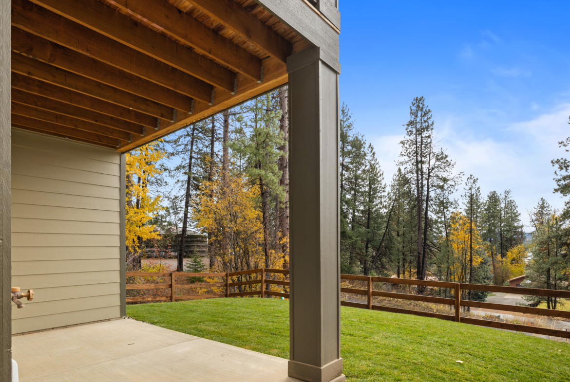view of the backyard from Ederra lot 6 with open space in the fall