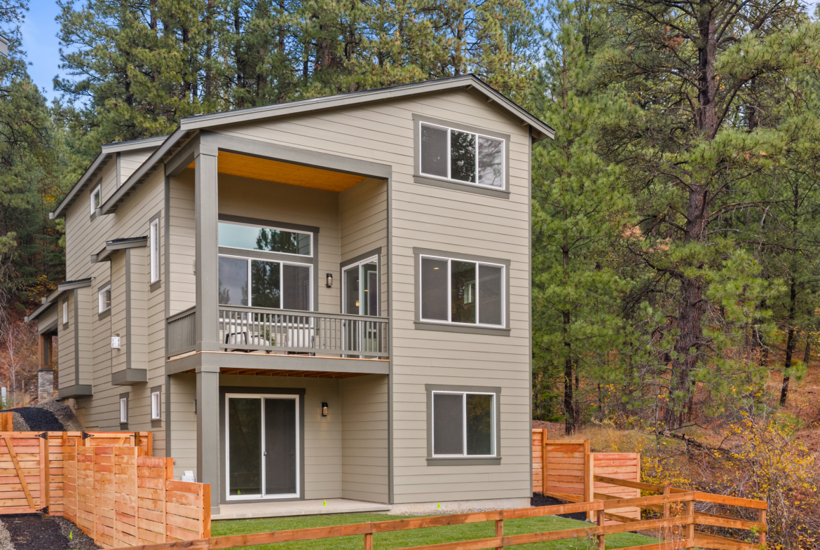 Ederra 6 abuts open space with fencing, backyard landscaping.