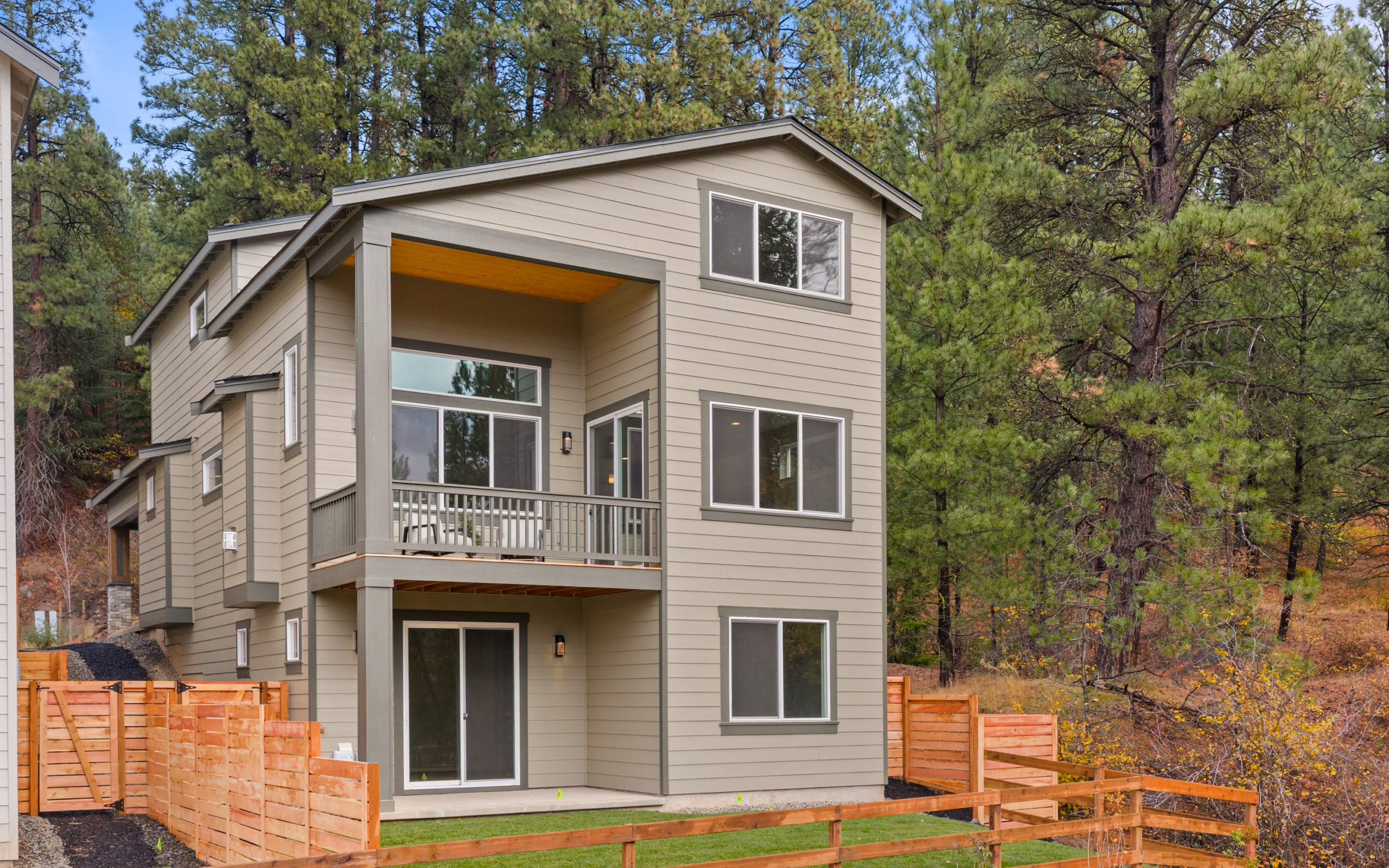 Ederra 6 abuts open space with fencing, backyard landscaping.