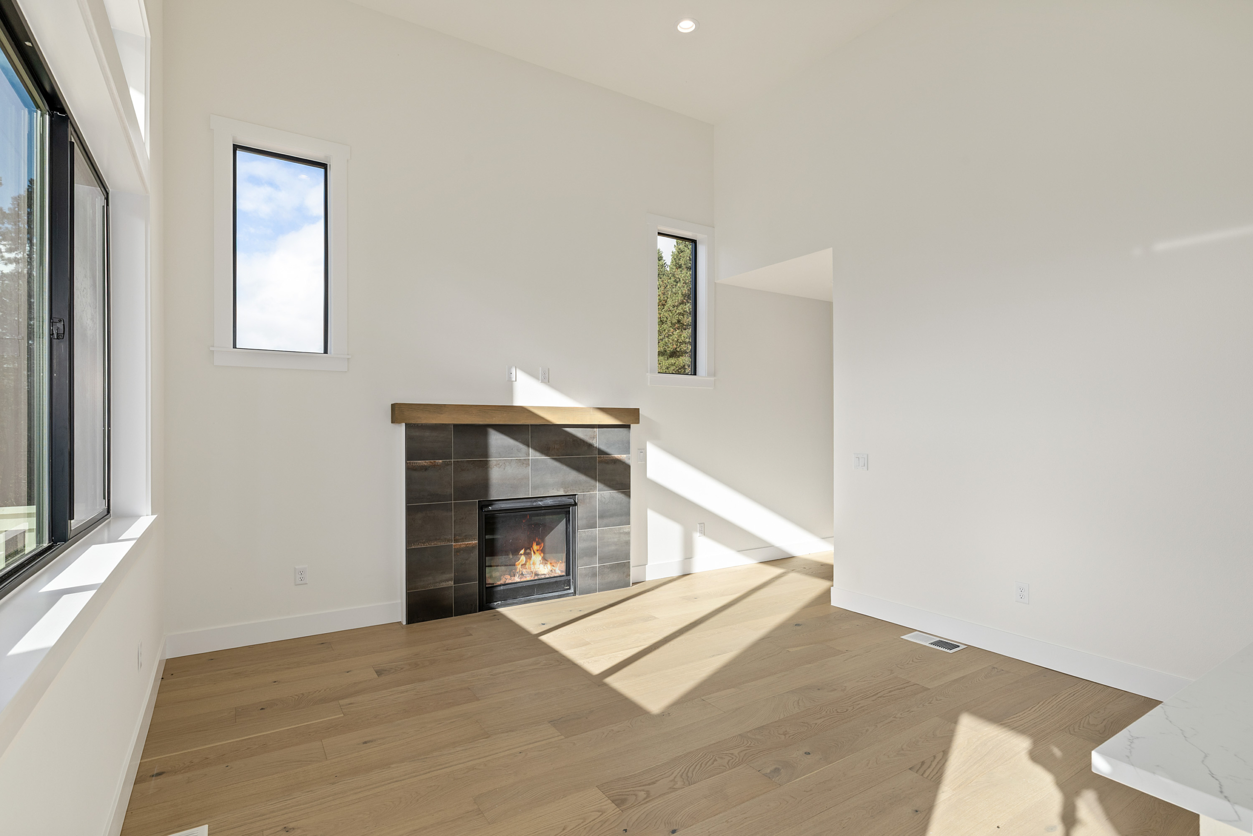 Ederra Lot 7 The Naches in Cle Elum by Trailside Homes living room with fireplace and mantel