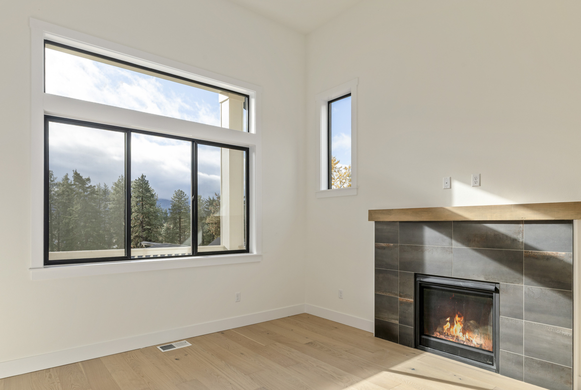 Ederra Lot 7 The Naches in Cle Elum by Trailside Homes living room with views of the trees