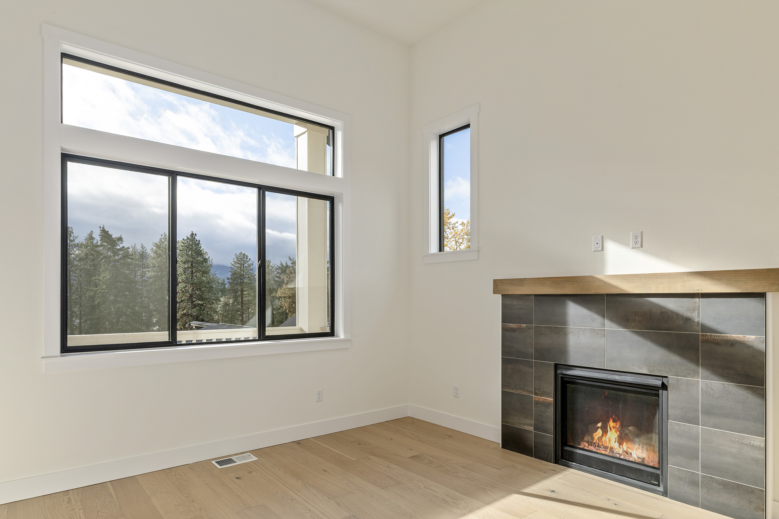 Ederra Lot 7 The Naches in Cle Elum by Trailside Homes living room with views of the trees