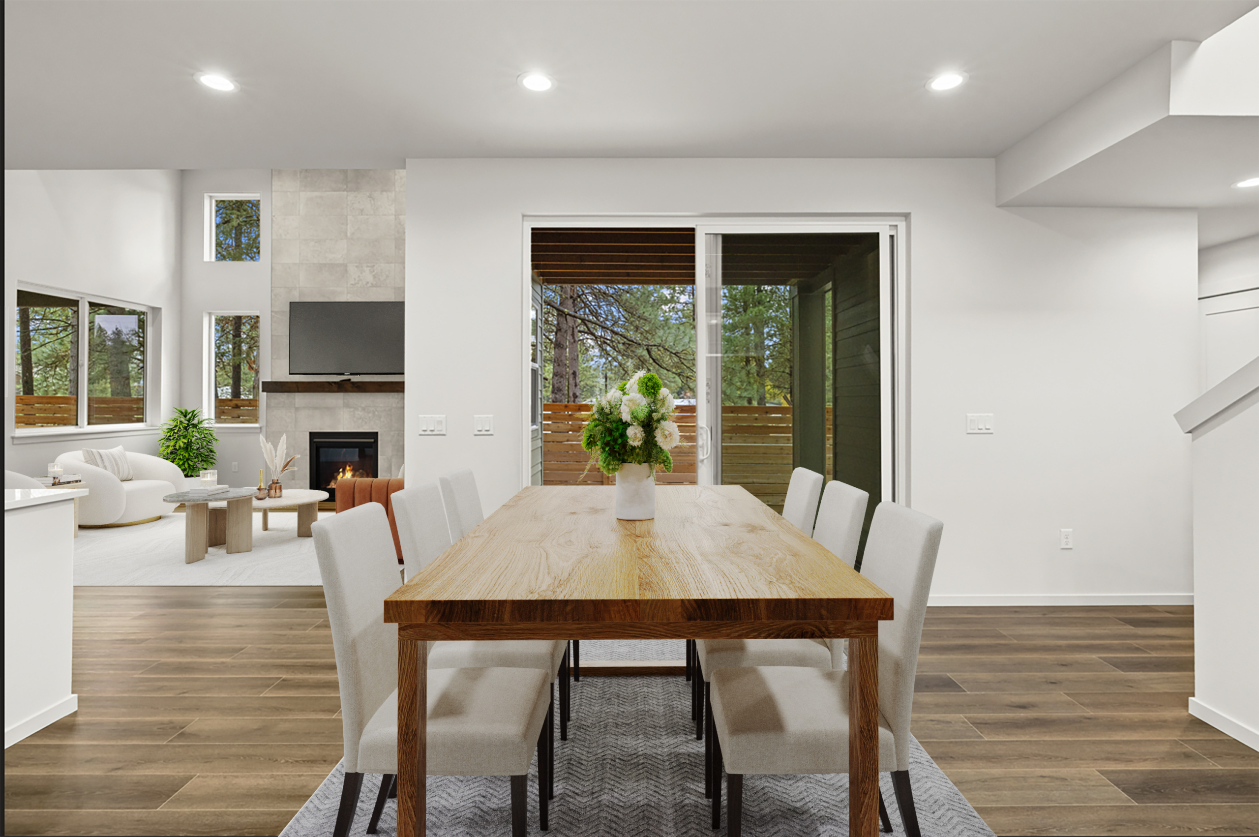 Tronsen by Trailside Homes in Ederra dining room that leads to the outdoor covered patio with view of the forest in Cle Elum