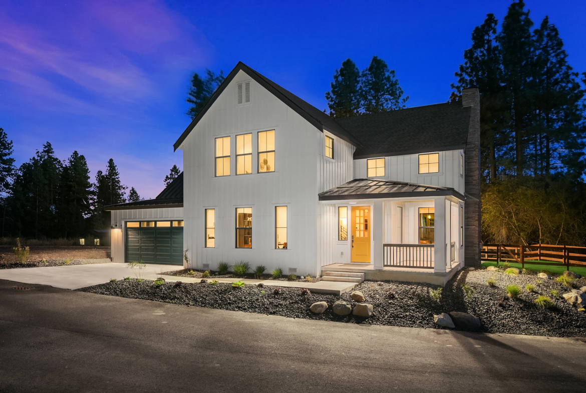 Ederra 12 Annapurna exterior twilight shot of the front of the home with covered porch