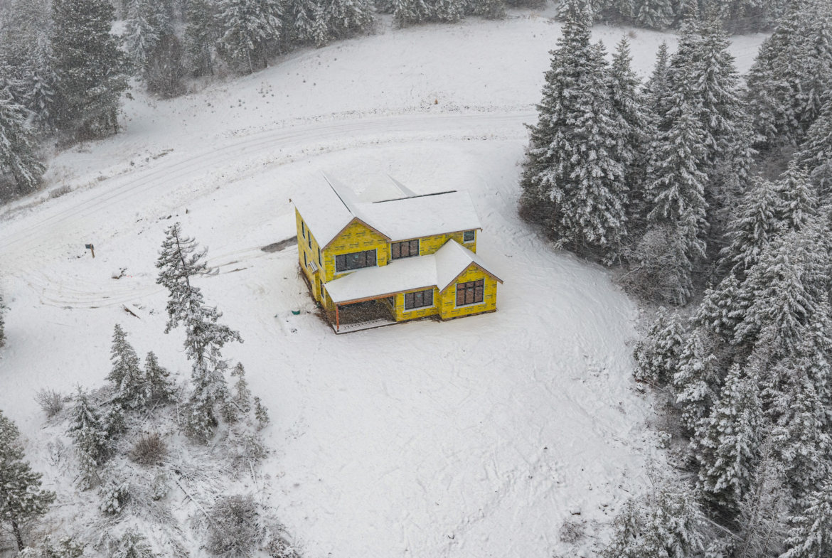 Skyline Ridge homesite 55 progress photo aerial shot covered in snow