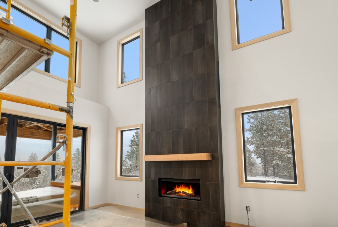 Skyline Ridge homesite 55 progress photo of living room with fireplace to the ceiling